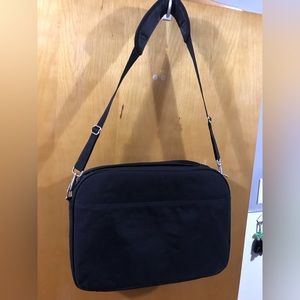 Laptop case / briefcase. Three zippers on top. Long shoulder or Crossbody strap.